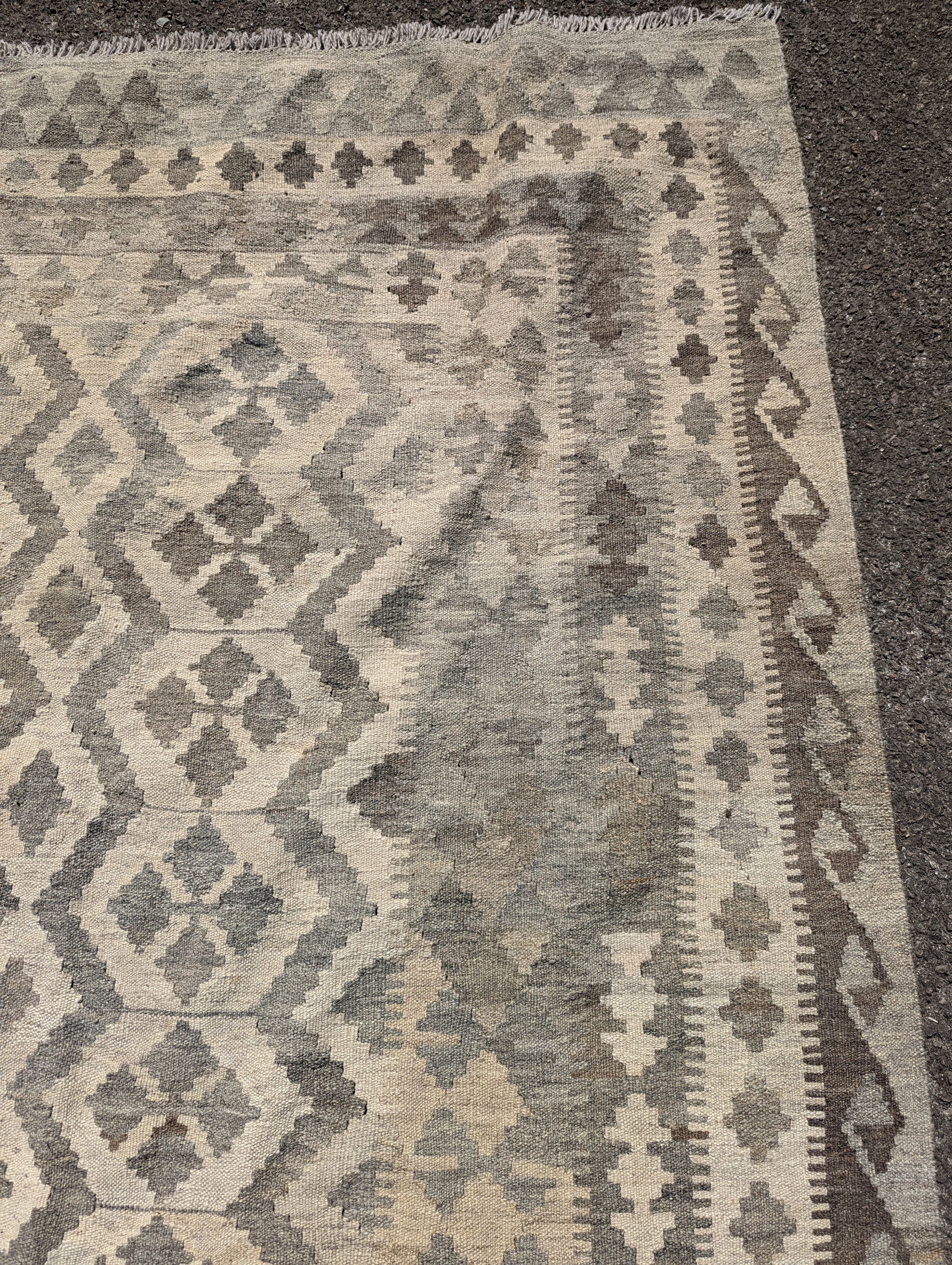 An Anatolian monochrome geometric flatweave carpet, 230 x 175cm